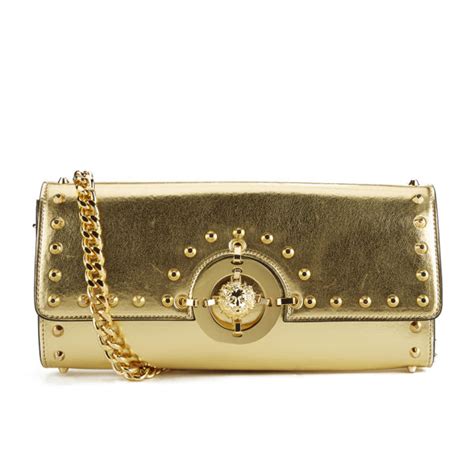 versus versace gold clutch|Versace black and white purse.